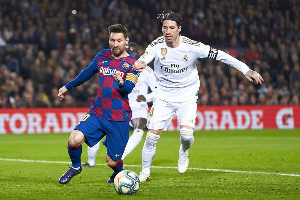 Lionel Messi scored a stoppage-time winner, holding up his jersey to the hostile Madrid crowd